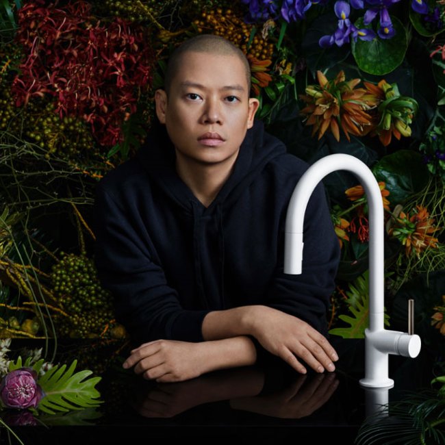 Jason Wu leaning beside his faucet